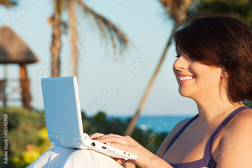 lovely woman with laptop computer © Syda Productions