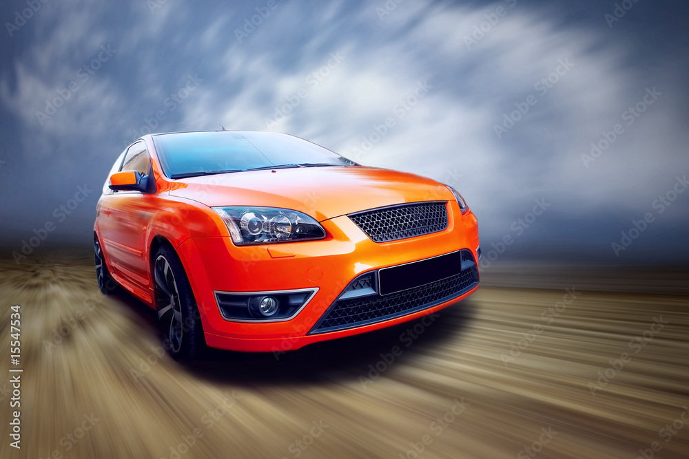 Naklejka premium Beautiful orange sport car on road
