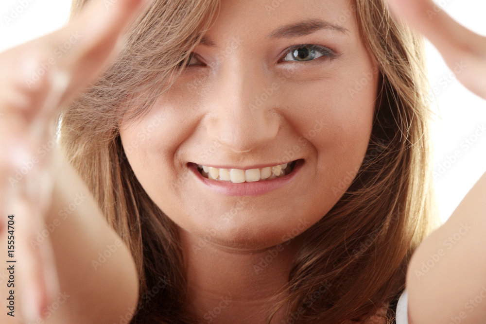 Beautyful young woman framing her face Beautyful young woman framing her face