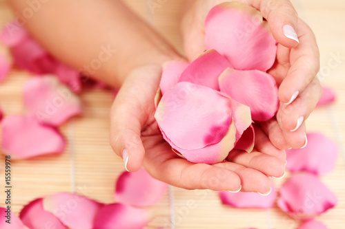 hands with rose petals