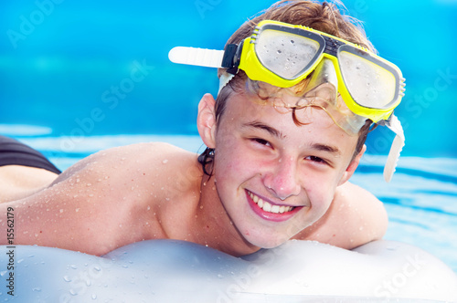 Happy boy in a pool