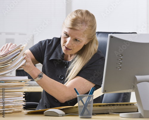Woman Looking Through Paperwork