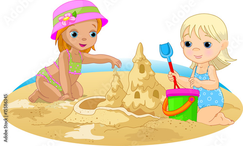 Two Little girls building a sand castle