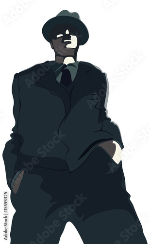 Young gangster in suit and hat