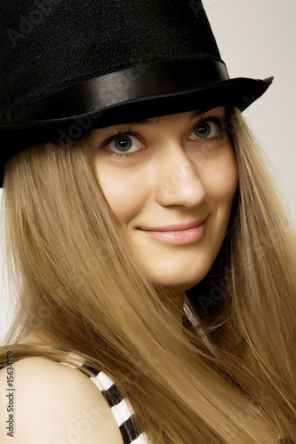 girl blonde in a funny black hat