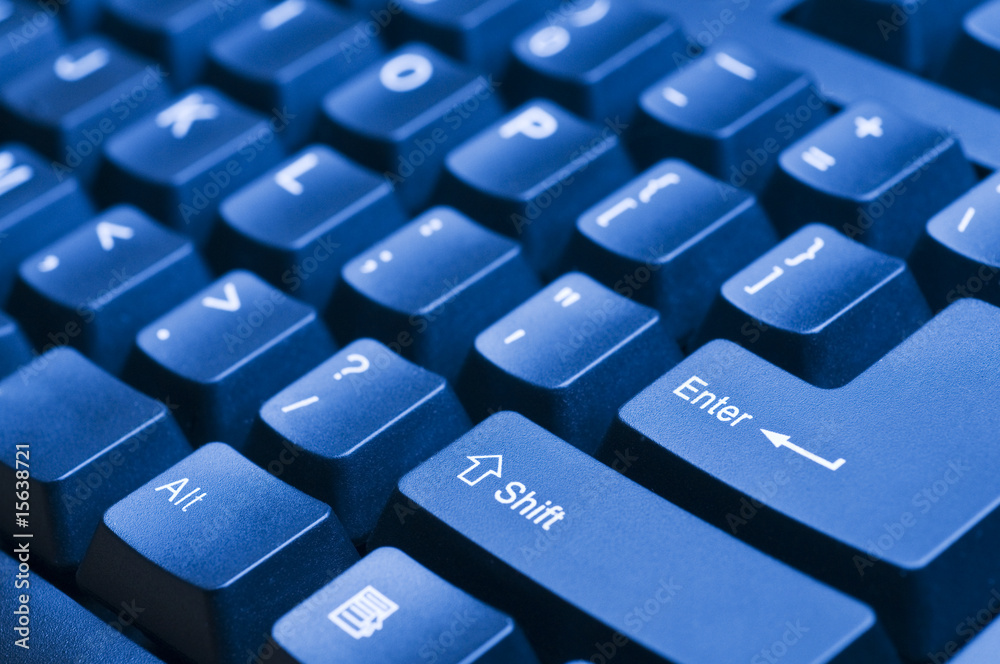 Macro view on the blue computer keyboard Macro view on the blue computer keyboard