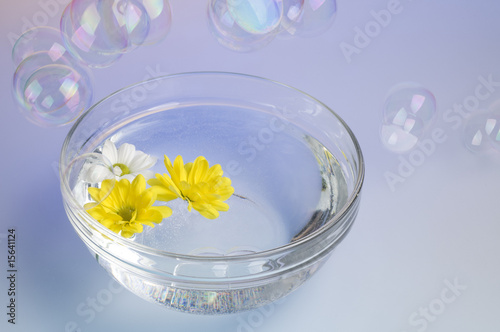 Bowl with dissolved sea salt and flowers.