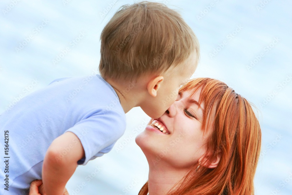 outdoor portrait of happy mother and son outdoor portrait of happy mother and son
