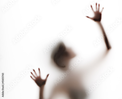 upper torso of abstract, semi-obscured figure with arms raised