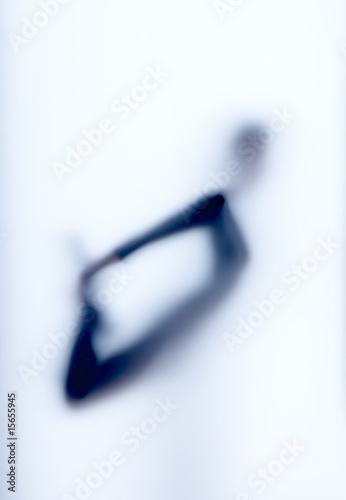 abstract, semi-obscured woman performing a yoga position