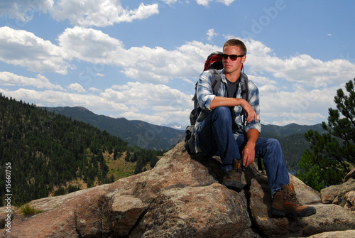 Rock climber on top of a mountain