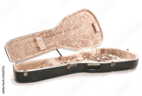 busking guitar case with british money