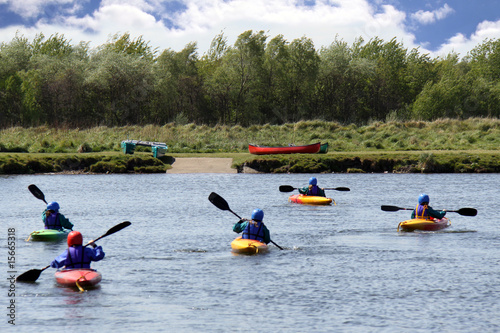 Group kyaking on a lake