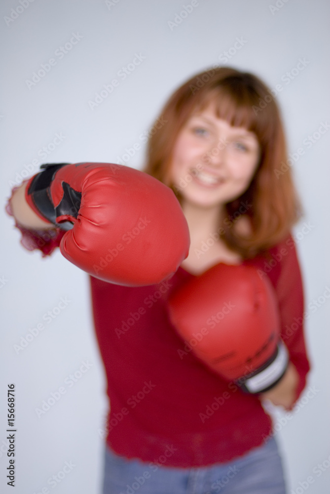 Girl wearing boxing gloves Girl wearing boxing gloves