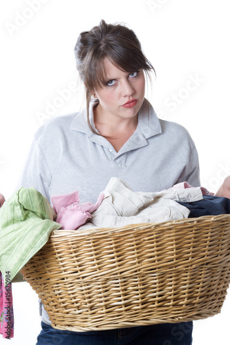 Young woman upset about having to do laundry; isolated