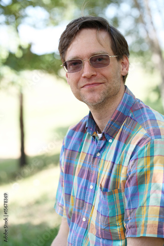 Smiling man enjoying outdoors in summer