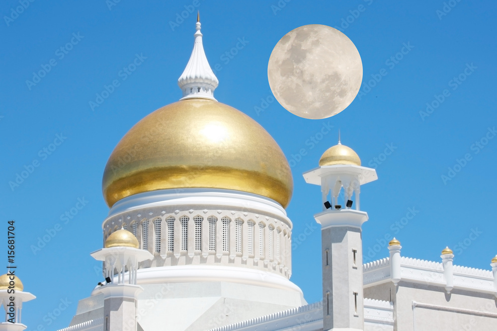 a golden mosque of a white building