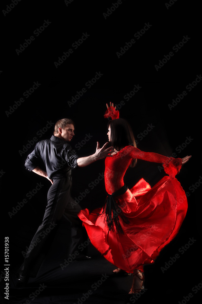 Fototapeta dancers against black background in action