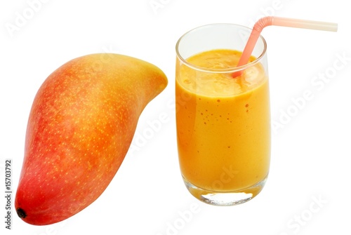 Fresh mango and glass of appetizing juice