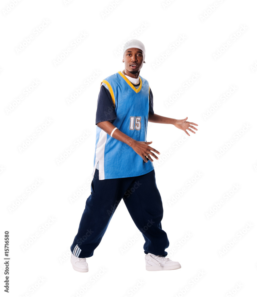 Fototapeta premium Hip-hop young man making cool move on white background