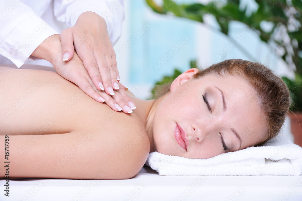 Woman getting back massage and relaxation Woman getting back massage and relaxation