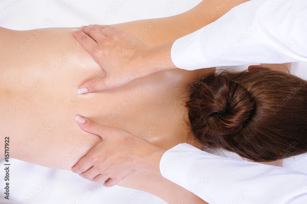 .Healthy back massage for the young woman - white background .Healthy back massage for the young woman - white background