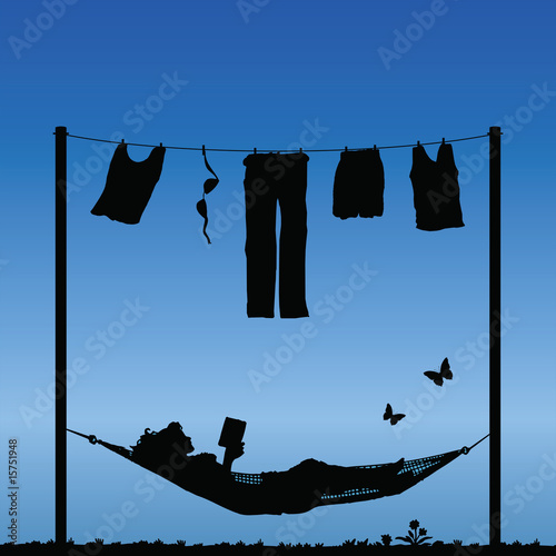 Woman reading in a hammock after finishing the washing