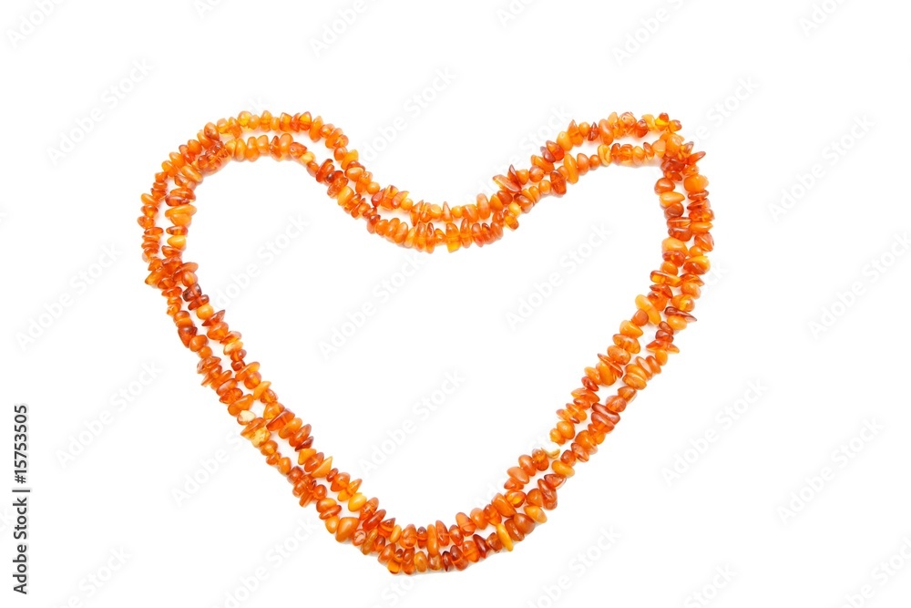 Obraz premium Amber beads double frame in shape of heart isolated