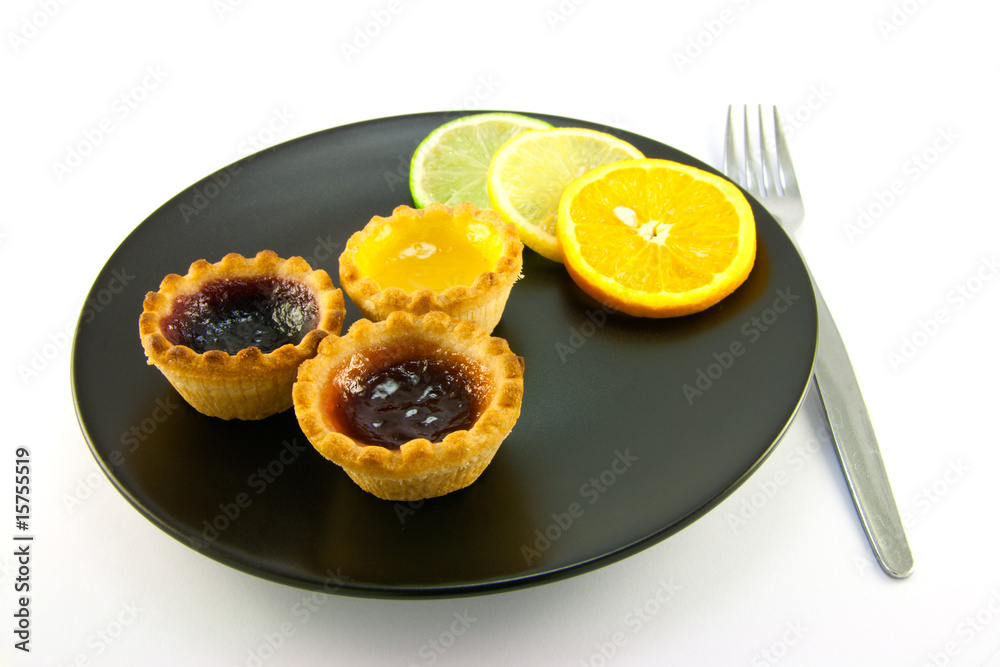 Jam Tarts with Citrus Slices and Fork Jam Tarts with Citrus Slices and Fork