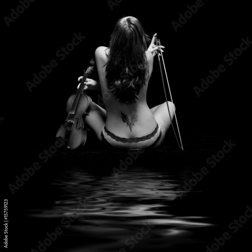 violinist isolated on black background