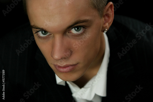 Portrait of a young man wearing a white shirt photo