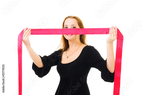romantic woman hiding behind red ribbon