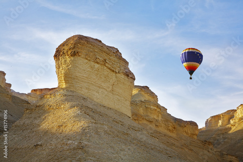 Huge balloon above ancient mountains