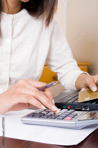 woman working on credit card bills
