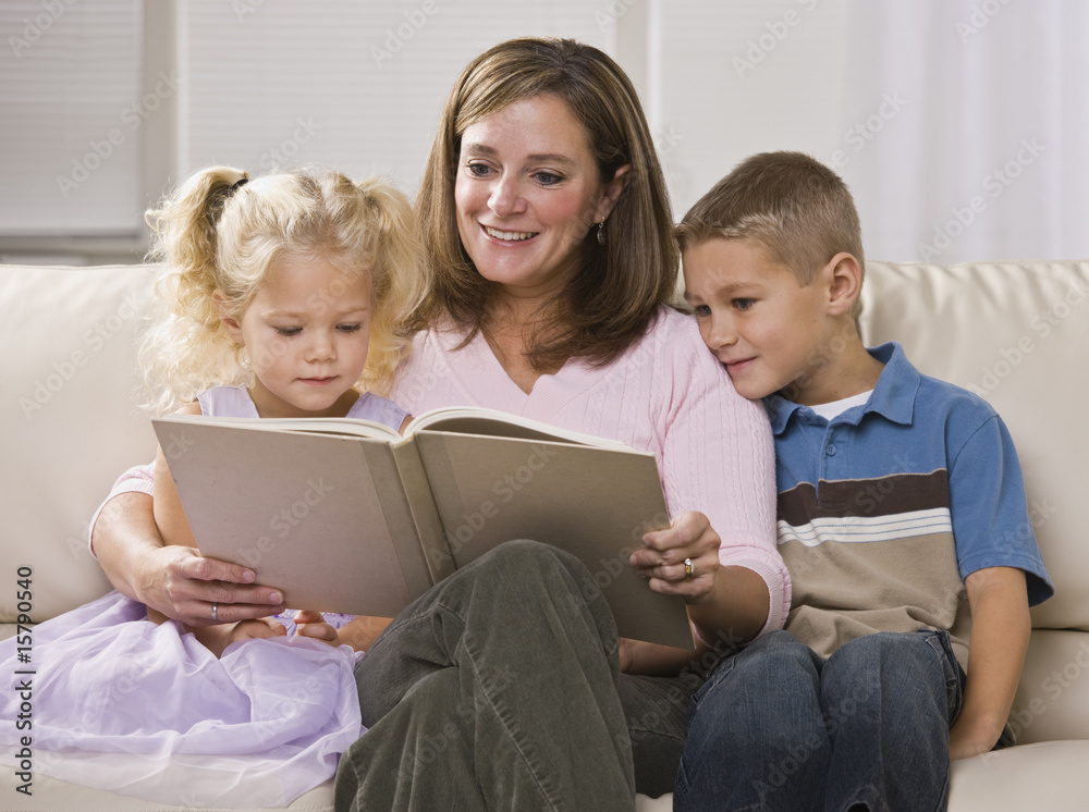 Happy Mother Reading to Children