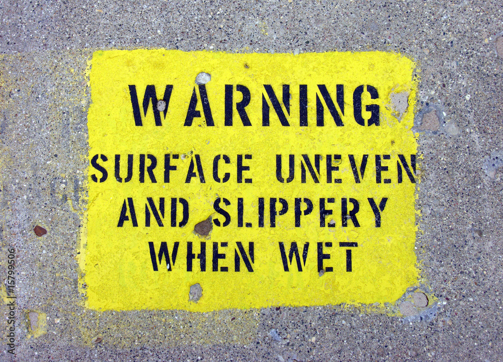 Fototapeta premium slippery surface warning stencil on pier