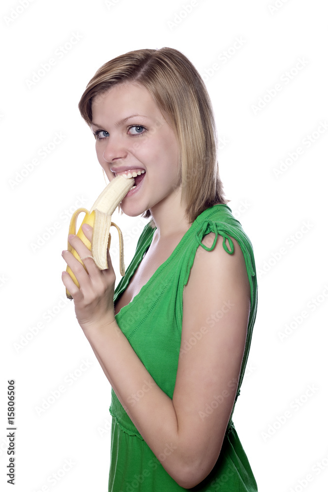girl in a green dress eats a banana girl in a green dress eats a banana