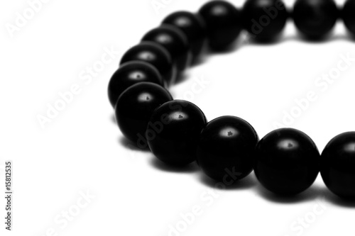 Black beads isolated on white background