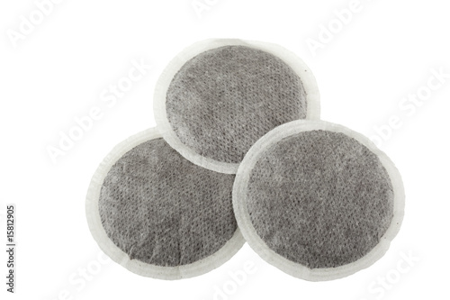 three coffee pads isolated on white
