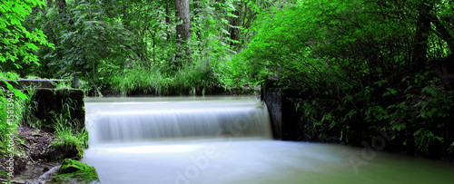 panoramic view of a waterfall in the English garden in Munich