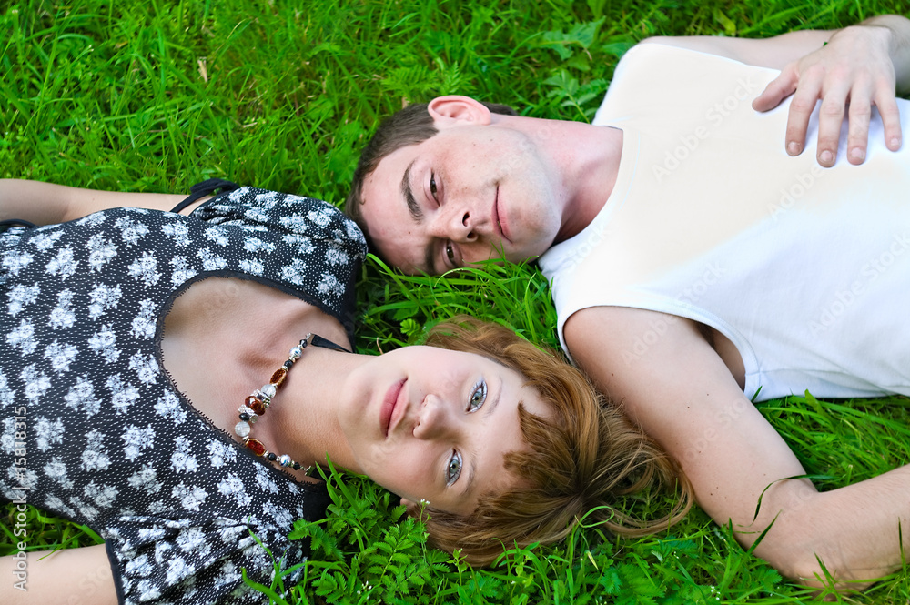 Loving couple on green meadow Loving couple on green meadow