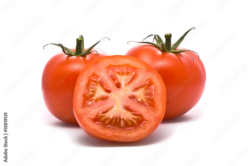 Fresh tomatoes. Macro studio isolated on white. Fresh tomatoes. Macro studio isolated on white.