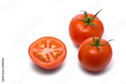 Fresh tomatoes. Macro studio isolated on white.