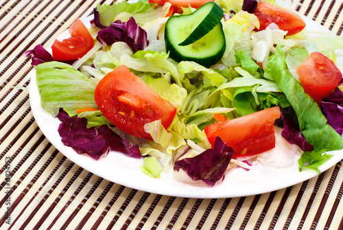 Fresh vegetable salad with tomato, lettuce, cucumber