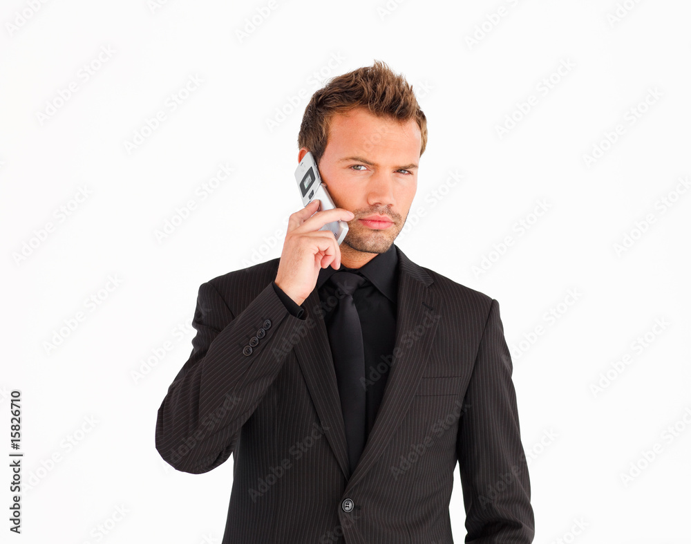 Young businessman using a cell phone Young businessman using a cell phone