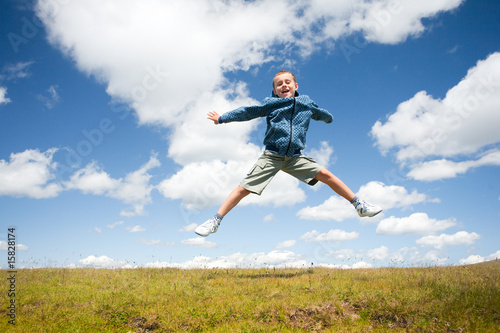 Cute kid jumping for joy