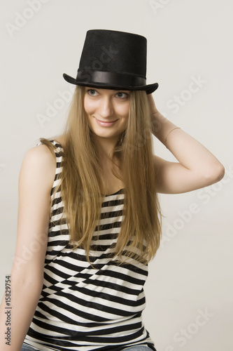 girl blonde in a funny  black hat
