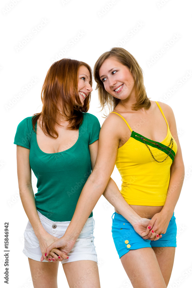 Two happy young women friends walk together Two happy young women friends walk together