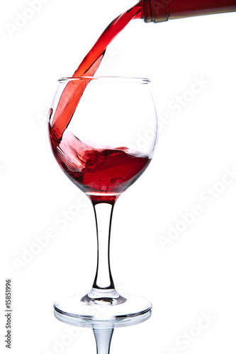ed wine pouring into glass isolated