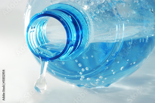 bottle mineral water with water drops